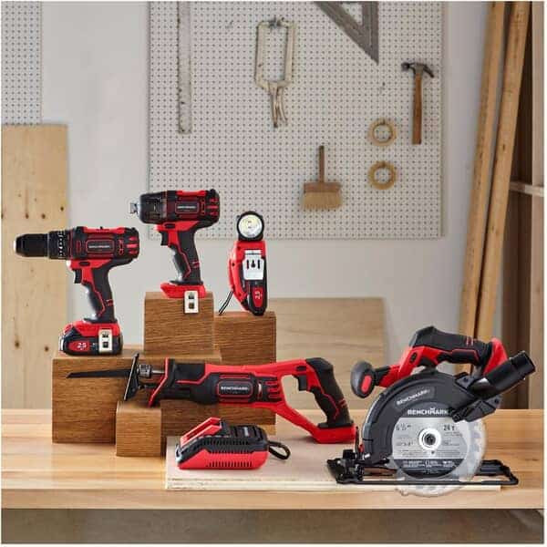 benchmark branded power tools on wooden work bench